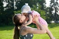 Young mother kiss her daughter