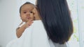 Young mother kissing on cheek baby Royalty Free Stock Photo