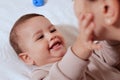 Young mother, kissing her baby boy at home. Family concept. Closeup portrait of loving mother young woman kissing little Royalty Free Stock Photo