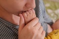 Young mother, kissing her baby boy at home. Family concept. Closeup portrait of loving mother young woman kissing little Royalty Free Stock Photo