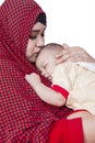 Young mother kissing her cute baby Royalty Free Stock Photo