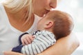 Mother kissing her cute son Royalty Free Stock Photo