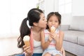 Young mother kissing her lovely little daughter Royalty Free Stock Photo