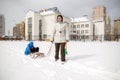 Young mother and little boy enjoying sleigh ride. Child sledding. Toddler kid riding sledge. Children play outdoors in snow. Kids Royalty Free Stock Photo