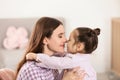 Young mother with daughter at home Royalty Free Stock Photo