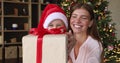 Young mother and little girl congratulate with Christmas by videocall