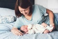 Young mother looking on her newborn baby. Royalty Free Stock Photo