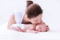 Young mother and newborn baby in white bedroom Royalty Free Stock Photo