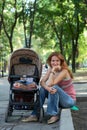 Young mother with perambulator