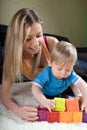 Young mother playing with baby boy Royalty Free Stock Photo