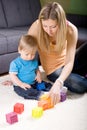 Young mother playing with baby boy Royalty Free Stock Photo