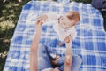 young mother playing with baby girl outdoors in a park, happy family concept. love mother daughter Royalty Free Stock Photo