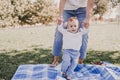 young mother playing with baby girl outdoors in a park, happy family concept. love mother daughter Royalty Free Stock Photo