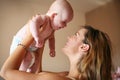 Young mother playing with her baby boy. Royalty Free Stock Photo