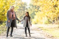 Young mother playing with her daughter in autumn park Royalty Free Stock Photo