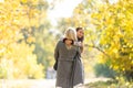 Young mother playing with her daughter in autumn park Royalty Free Stock Photo