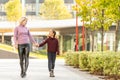 Young mother playing with her daughter in autumn park Royalty Free Stock Photo