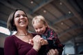 Young mother is playing with her little son indoors Royalty Free Stock Photo