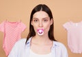 Portrait, a young mother posing with a pacifier in her mouth Royalty Free Stock Photo