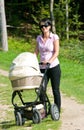 Young mother with pram Royalty Free Stock Photo