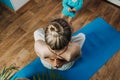 Young mother sitting on the floor, enjoy meditation do yoga exercise at home with his little daughter baby girl. Mental