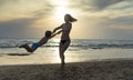 Young mother and smiling baby boy son playing on the beach on the Sunset. Positive human emotions, feelings, joy. Funny cute child Royalty Free Stock Photo