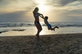 Young mother and smiling baby boy son playing on the beach on the Sunset. Positive human emotions, feelings, joy. Funny cute child Royalty Free Stock Photo