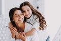 Young Mother and Smiling Little Daughter Hugging Royalty Free Stock Photo
