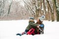 Young mother and son having fun in winter park. Family playing with snow outdoors. Happy christmas vacation Royalty Free Stock Photo