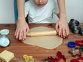 Young mother and son in kitchen making cookies Royalty Free Stock Photo