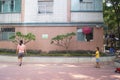 A young mother and son play badminton