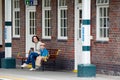 Young mother and son on railway station platform Royalty Free Stock Photo