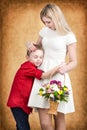 Young mother and son tenderly embrace.Spring concept of family vacation and family love. Women`s day