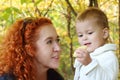 Young mother talks with her little daughter