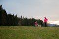 Young mother and toddler daughter with their pet dog Royalty Free Stock Photo