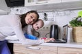 Young mother with toddler in her arms talking online with psychologist Royalty Free Stock Photo