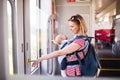 Young mother travelling with baby by train. Royalty Free Stock Photo