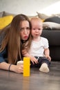 Young mother tries to comfort her crying baby Royalty Free Stock Photo