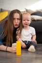 Young mother tries to comfort her crying baby Royalty Free Stock Photo