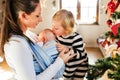 Young mother with two children at Christmas time. Royalty Free Stock Photo