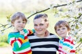 Young mother and two little twins boys having fun Royalty Free Stock Photo