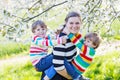 Young mother and two little twins boys having fun Royalty Free Stock Photo
