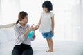 Asian Young mother washes her little girl`s hand by using a hand wash sanitizer gel. In the epidemic virus situation