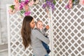 Young mother woman holding and hugging in her arms child baby kid boy smilling laughing Royalty Free Stock Photo