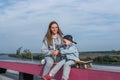 Young mother woman with little boy son of 4-5 years old, play and have fun, laugh and enjoy rest, summer autumn in city Royalty Free Stock Photo