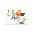 Young Mother Working at Home on Laptop Computer, Her Sons Playing Next to Her, Freelancer, Parent Working with Children Royalty Free Stock Photo