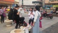 Shenzhen, China: Young mothers or grandmothers play outdoors with their children