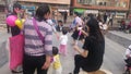 Shenzhen, China: Young mothers or grandmothers play outdoors with their children