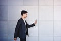 Young motivation Businessman Reading Message via Smart Phone while Walk