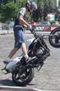 Young motorbiker performing stunts on his tuned bike